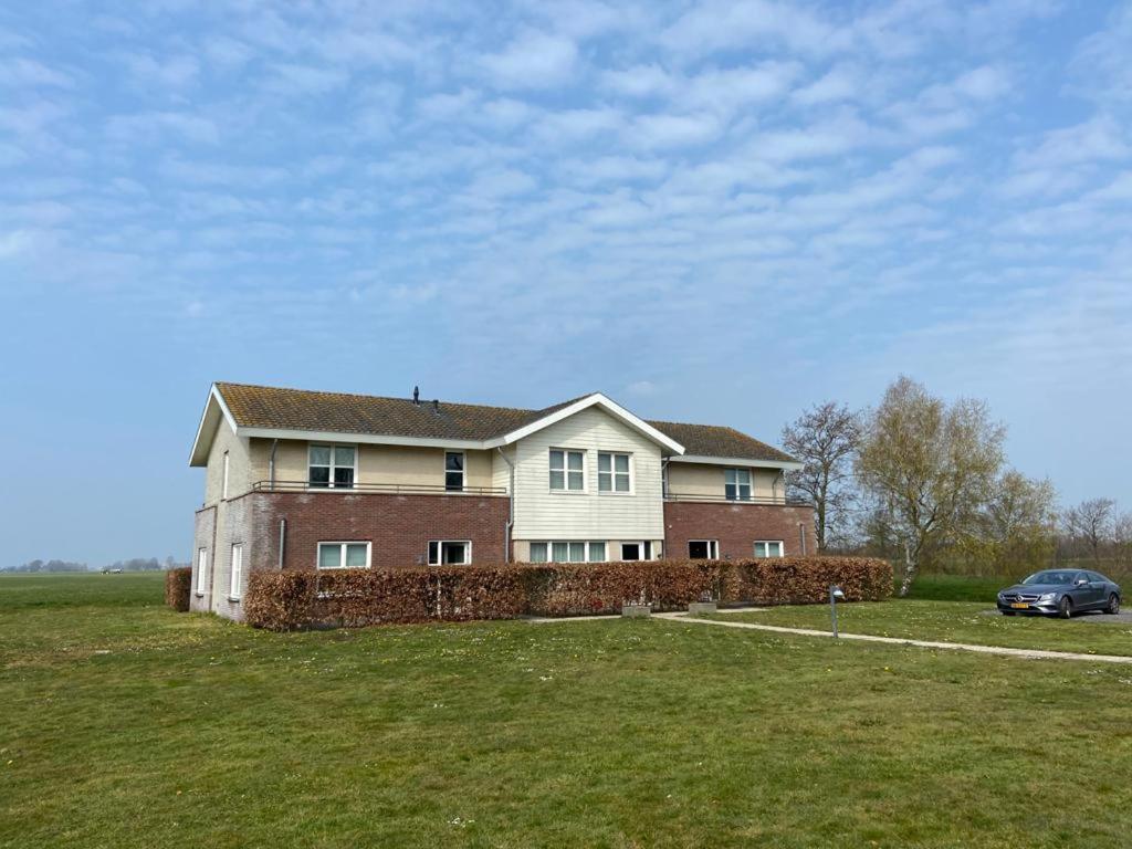 Landhotel De Ijsvogel Sint Nicolaasga Exterior foto